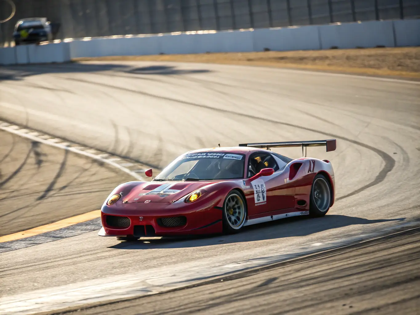 A high-speed shot of a race car navigating a challenging turn on a professional race track, emphasizing the adrenaline and precision of competitive racing.